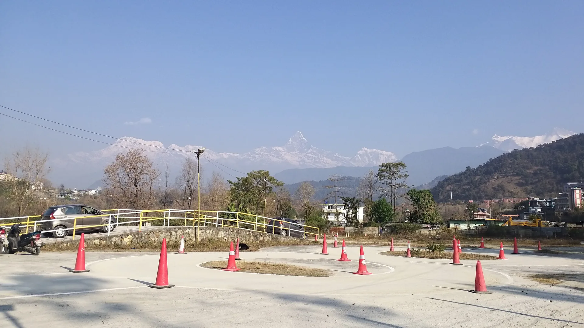 The Sunrise Driving School training ground in Fulbari with the Annapurna mountain range and Machapuchhre peak in the background