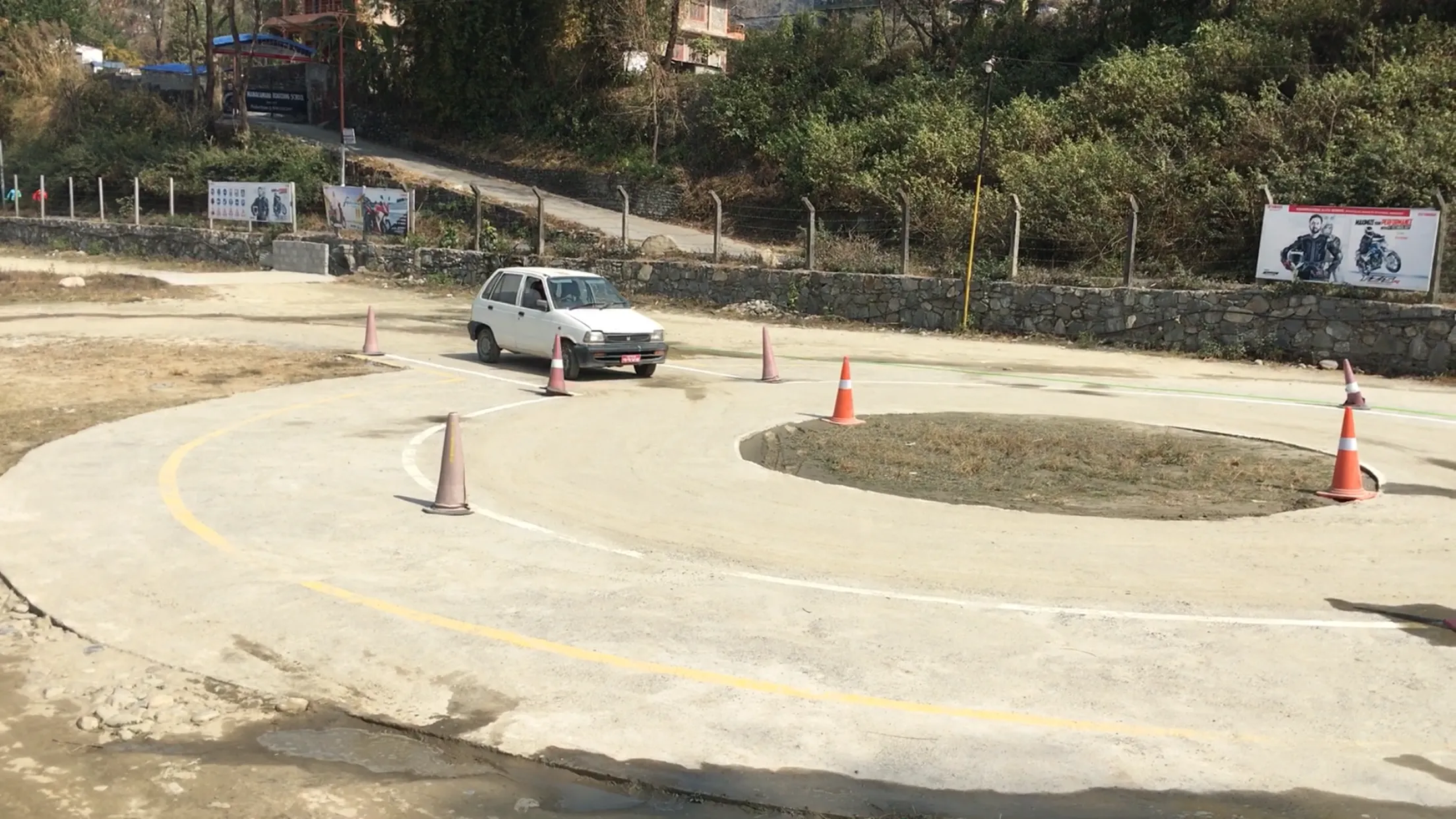 Training car practising a tight turn through cones on the Sunrise wide-ground course